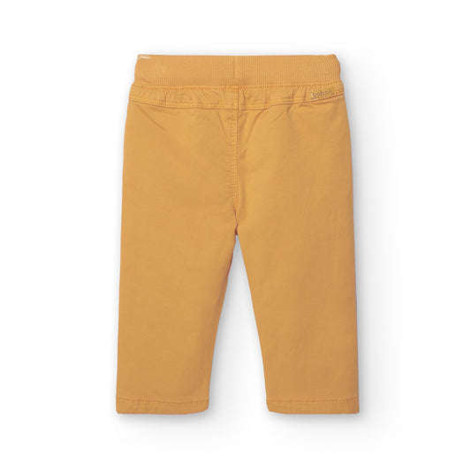 Pantalón jogger mostaza mini niño