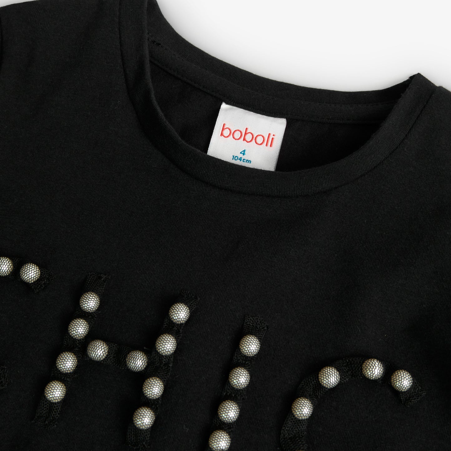 Blusa negra con perlas para niña jr