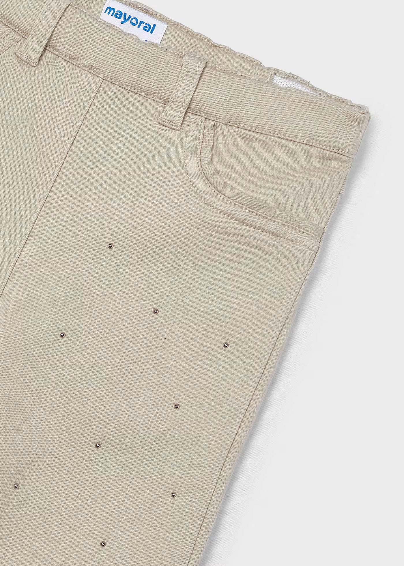 Pantalón beige tachuelas para mini niña